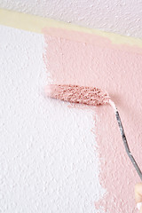 Image showing painting a wall in pink