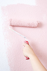 Image showing painting a wall in pink