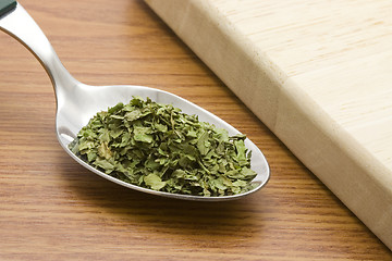 Image showing Spoonful of chopped coriander leaves

