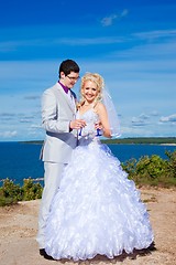 Image showing  happy groom and bride on a sea coast