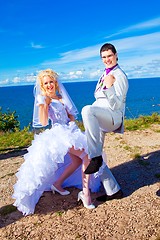 Image showing  happy groom and bride on a sea coast