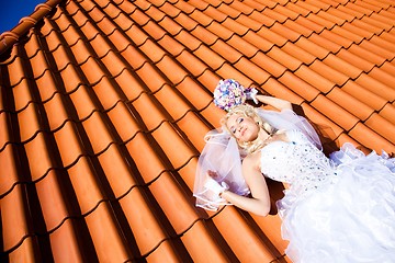 Image showing beautiful bride on tile roof