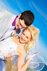 Image showing happy groom and bride on a sea coast