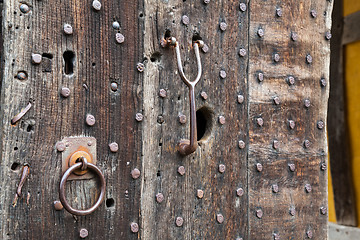 Image showing Heavily studded oak door at entrance to castle