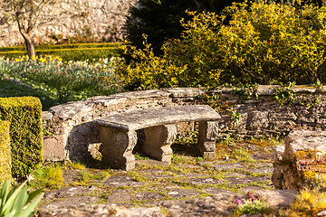 Image showing Old stone carved bench in garden