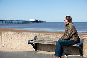 Image showing Senior man looking out over beach at Southport