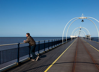 Image showing Senior man looking out over beach at Southport