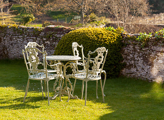 Image showing Garden table and chairs on lawn
