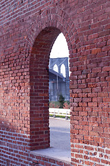 Image showing Brooklyn Bridge framed through brick window