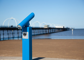 Image showing Blue telescope by blurred Southport pier