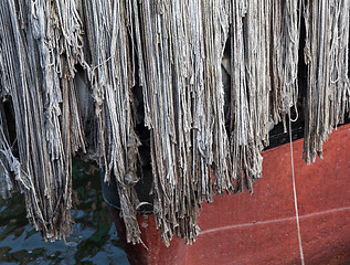 Image showing Rope bumper on front of ship in dock