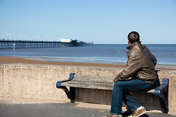 Image showing Senior man looking out over beach at Southport