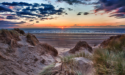 Image showing Sunset over Formby Beach through dunes