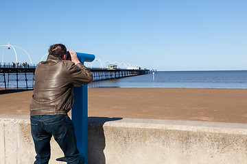 Image showing Senior man looking out over beach at Southport