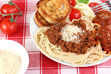 Image showing Spaghetti dinner with meatballs, sauce and salad.