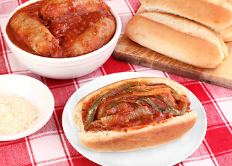 Image showing Sausage sub with peppers, onions and tomato sauce.