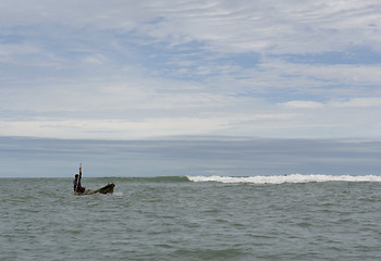 Image showing the latin man in boat on pacific