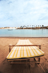 Image showing Sunbeds on the beach