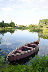 Image showing boat moored chains river shore. water transport 