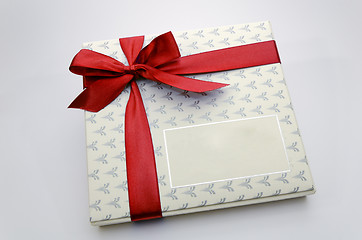 Image showing Printed over a red ribbon gift box