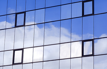 Image showing Sky and clouds reflected in a modern building glass facade