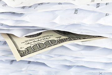 Image showing $ 100 bill in the paper chaos