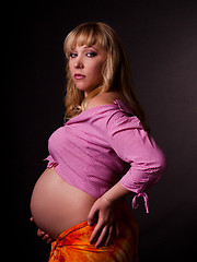 Image showing art portrait of pregnant woman on a black background
