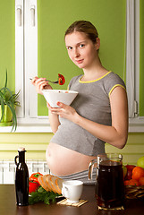 Image showing Pregnant Woman On Kitchen