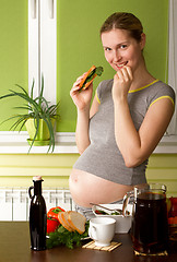 Image showing Pregnant Woman On Kitchen