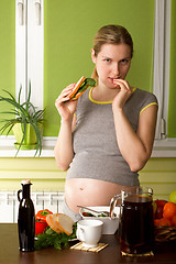 Image showing Pregnant Woman On Kitchen