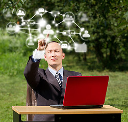Image showing Man with Laptop Working Outdoors in Social Network