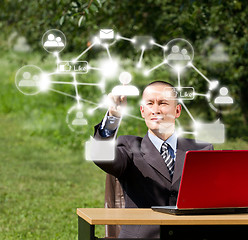 Image showing Man with Laptop Working Outdoors in Social Network