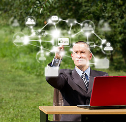 Image showing Man with Laptop Working Outdoors in Social Network