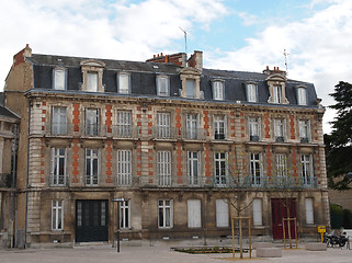 Image showing Typical white tuff, red brick , blue slate building.