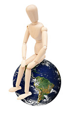 Image showing Wooden Puppet on Globe