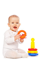 Image showing Small child play with toys on white background