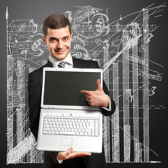 Image showing Businessman With Open Laptop In His Hands