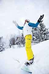 Image showing Winter woman with snowboard