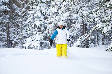 Image showing Winter woman with snowboard