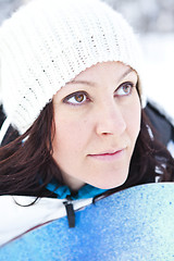 Image showing Winter woman with snowboard