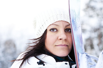 Image showing Winter woman with snowboard
