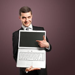 Image showing Businessman With Open Laptop In His Hands