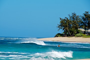 Image showing Lone surfer amongst breaking waves