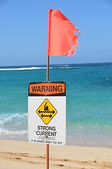 Image showing Strong current warning sign and flag