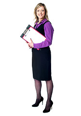 Image showing Smiling business woman with documents