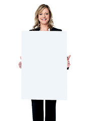 Image showing Business woman showing blank signboard