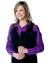 Image showing Corporate lady holding business documents
