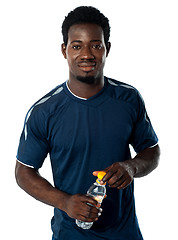 Image showing Fit man posing with water bottle