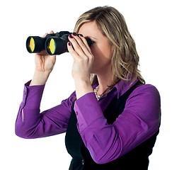 Image showing Businesswoman looking through binoculars