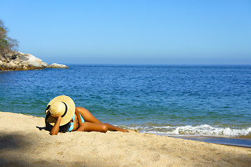 Image showing Woman lying on the beach